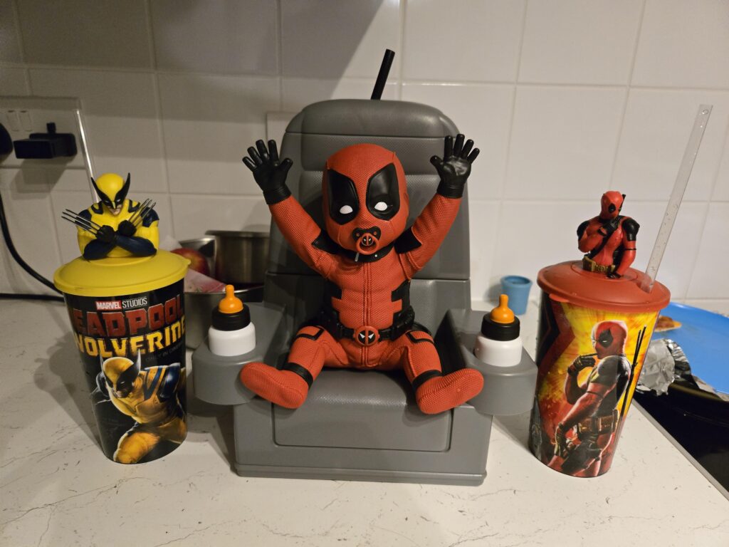 Pop culture and movie merchandise have always gone hand in hand, with fans eager to collect anything "Baby Deadpool Popcorn Bucket"